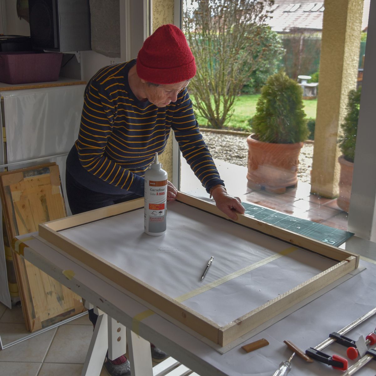 Prue framing a sculptural watercolour painting