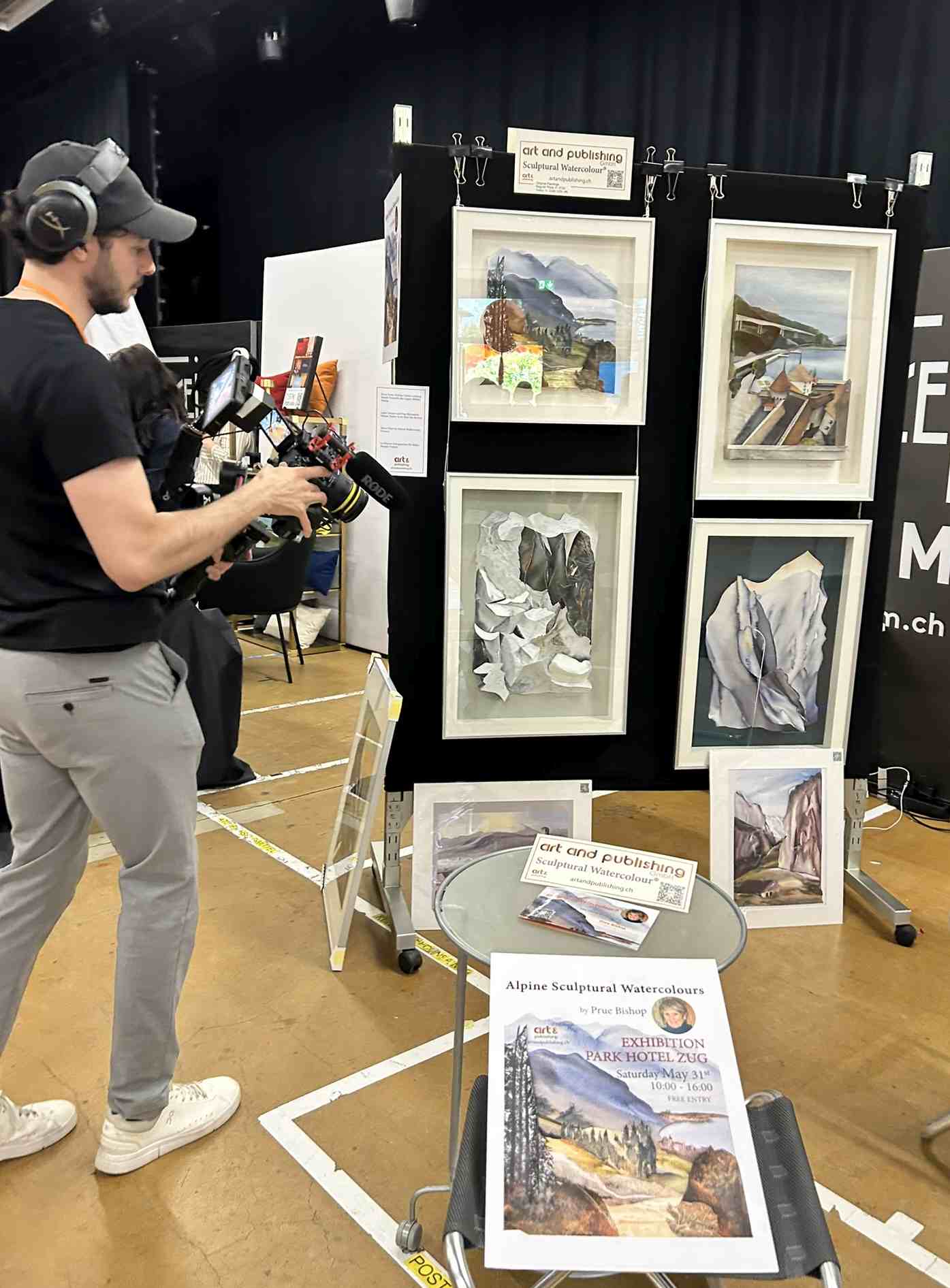 Camera crew filming Prue Bishop’s exhibition stand at Expat Expo Zug 2025